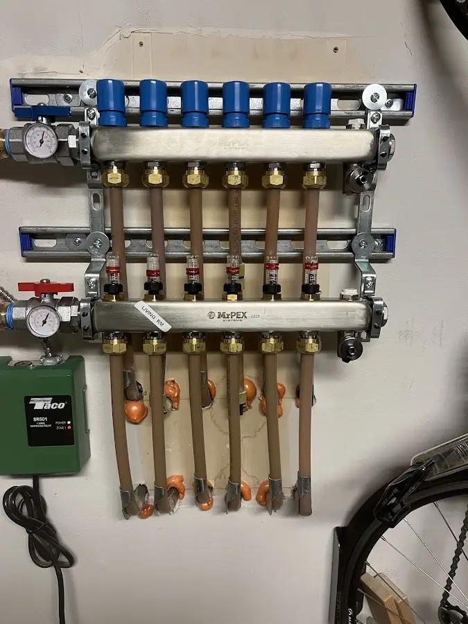 Plumber performing Water Heater Repair at a residential property in Boxborough