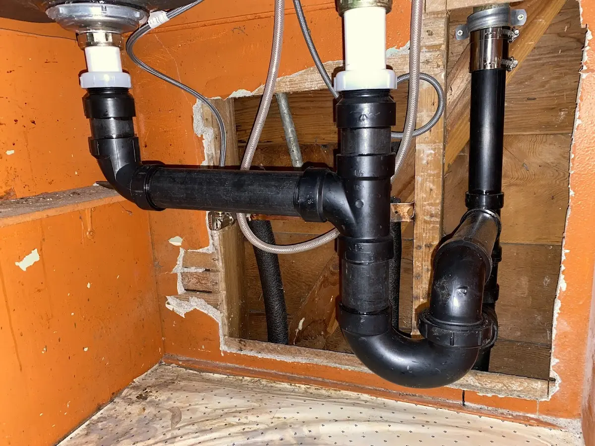 Professional Garbage Disposal Repair equipment and tools on the job in Boxborough